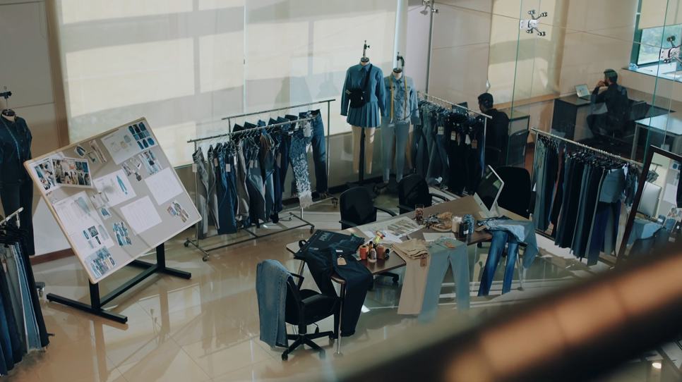 Denim development studio with sample racks, mood boards and dressed mannequins